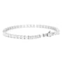 A silver tennis bracelet featuring baguette and round-cut clear stones, displayed in a circular shape against a plain white background.