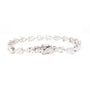 A silver tennis bracelet featuring a continuous link design of marquise and pear-cut clear gemstones, displayed on a solid white background.