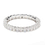 A silver-toned eternity ring featuring a continuous row of round brilliant-cut diamonds and baguette-cut diamonds, set against a plain white background.