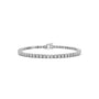A silver tennis bracelet with a continuous row of round-cut clear gemstones and a small clasp, shown on a plain white background.