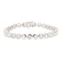 A silver tennis bracelet featuring a row of round-cut clear gemstones in bezel settings, displayed on a clean white background.
