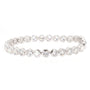 A silver tennis bracelet featuring round-cut clear gemstones in a continuous row, set in a polished silver-tone metal, shown against a plain white background.