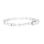 A silver-toned diamond tennis bracelet featuring a mix of baguette, round, and marquise-cut diamonds, displayed against a solid white background.