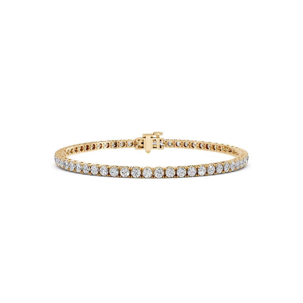 A yellow gold tennis bracelet featuring a continuous row of round-cut clear gemstones, displayed on a clean white background.