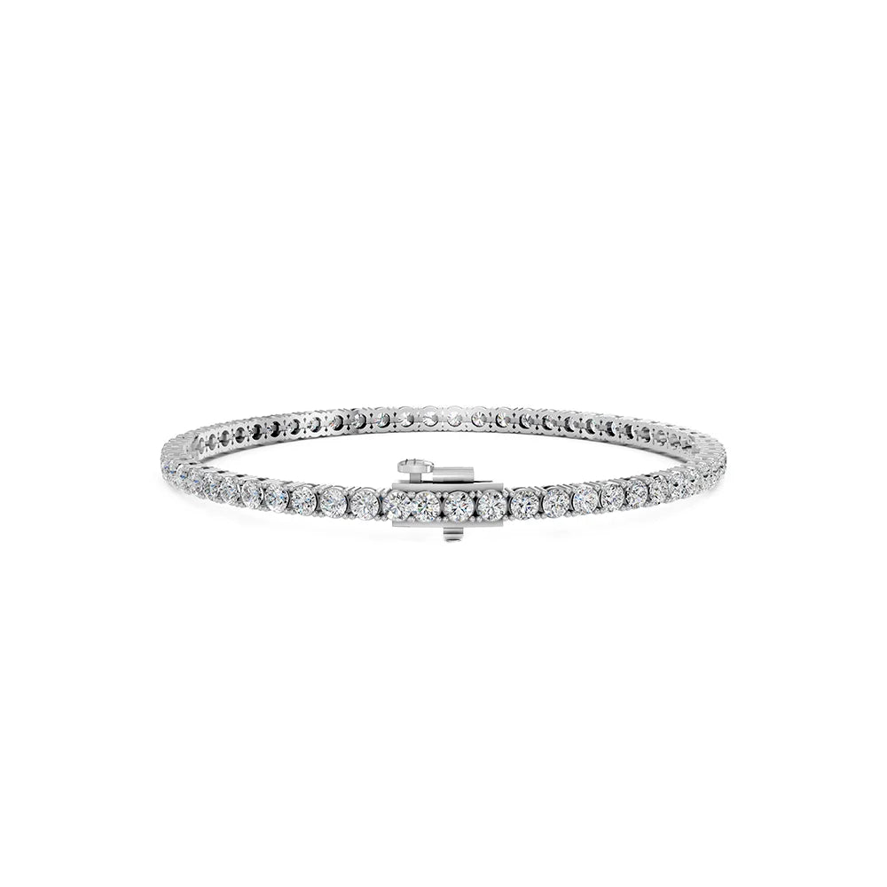 A silver tennis bracelet with a central clasp, featuring a row of clear round-cut stones, shown against a plain white background.
